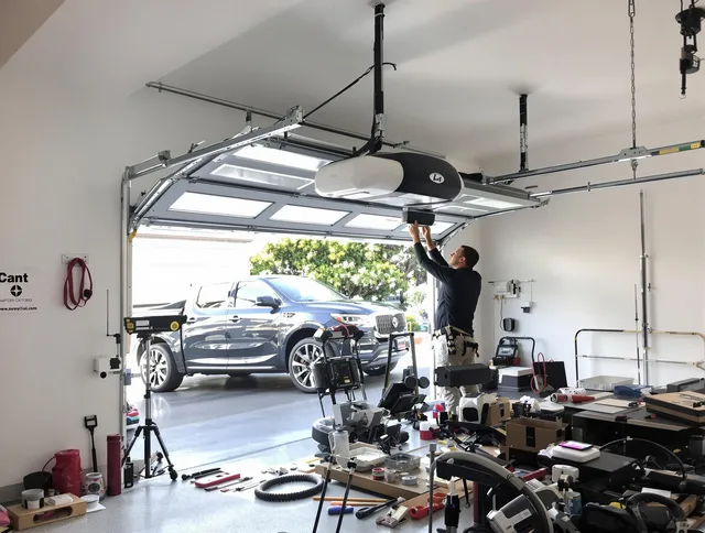 Bedford Garage Door Repair specialist installing smart garage door opener system in Bedford home