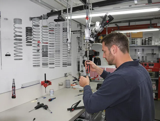 Bedford Garage Door Repair safety certified technician performing precision spring replacement in Bedford